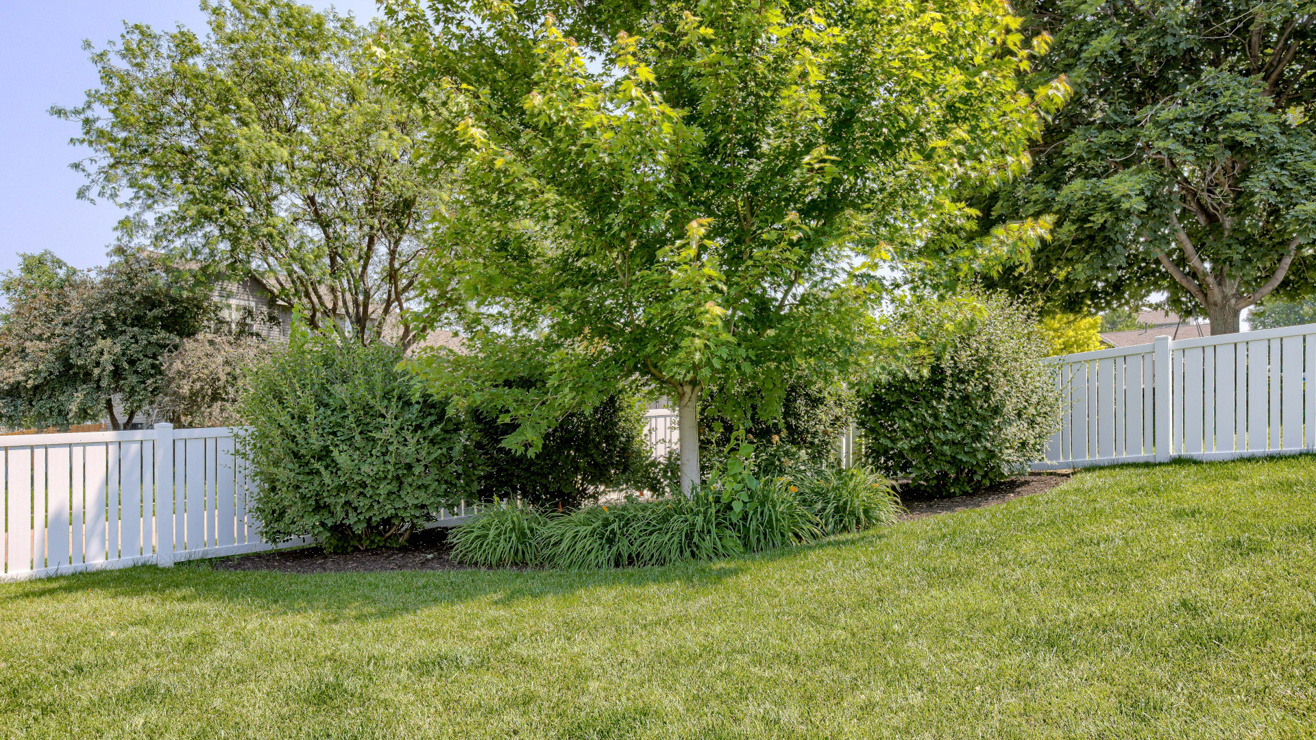 vinyl fence on a hill
